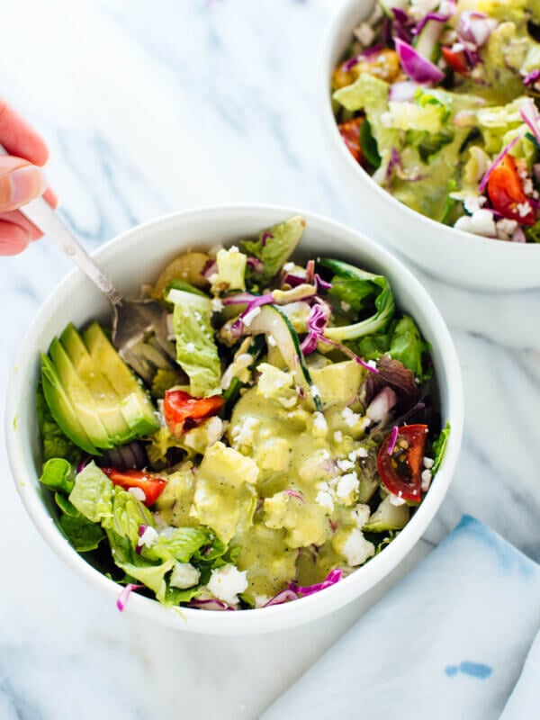 This delicious Mexican green salad with jalapeño-cilantro dressing is super fresh and mega nutritious! Vegetarian (easily vegan) and gluten free. cookieandkate.com
