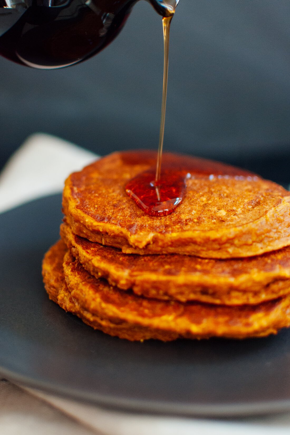 Delicious gluten-free pumpkin pancakes made with only one flourโoat flour!