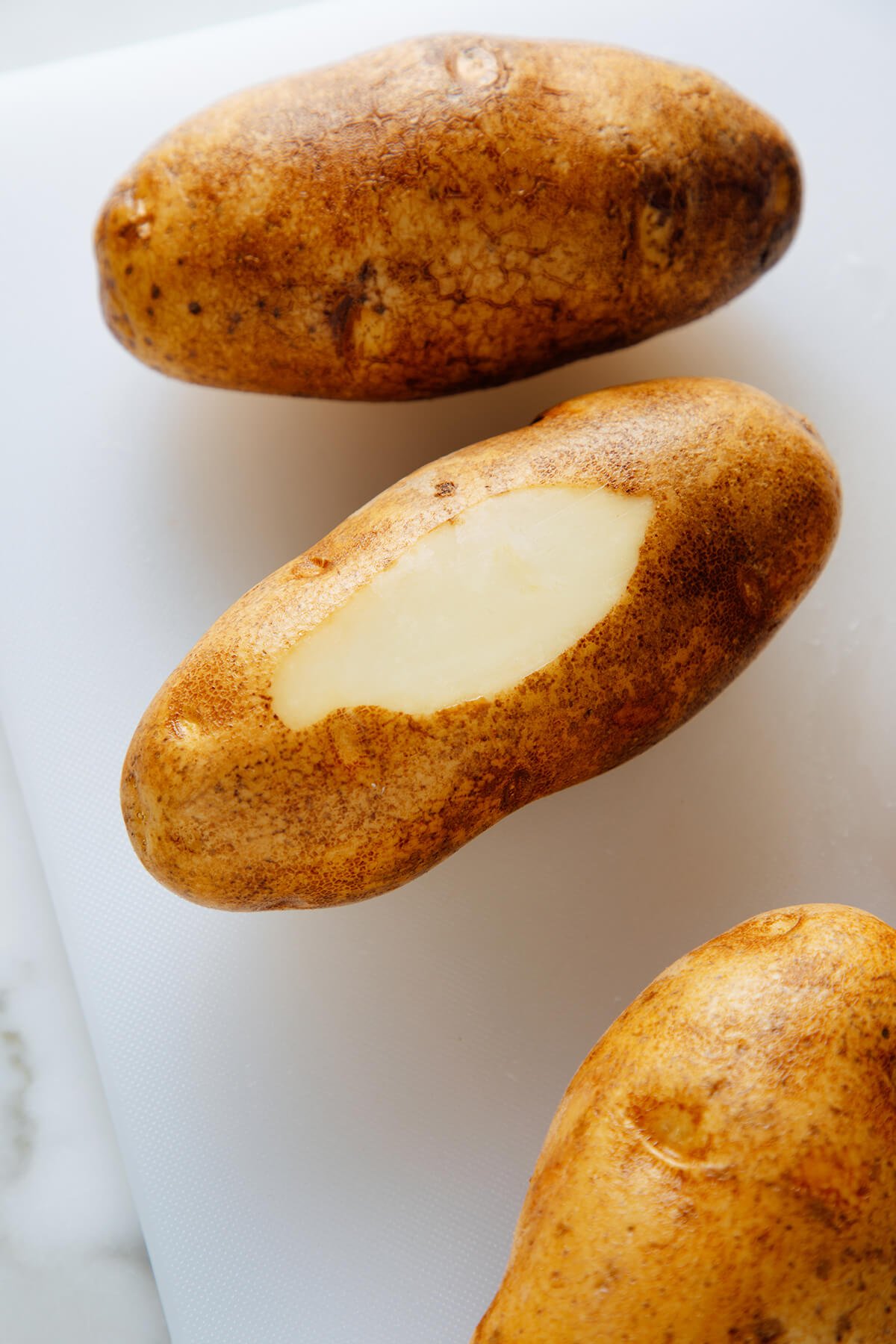 preparing Hasselback potatoes